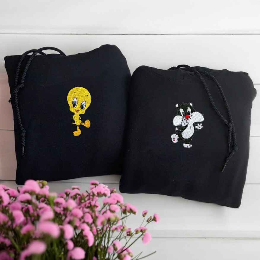 Matching black hoodies with Tweety and Sylvester cartoon characters
