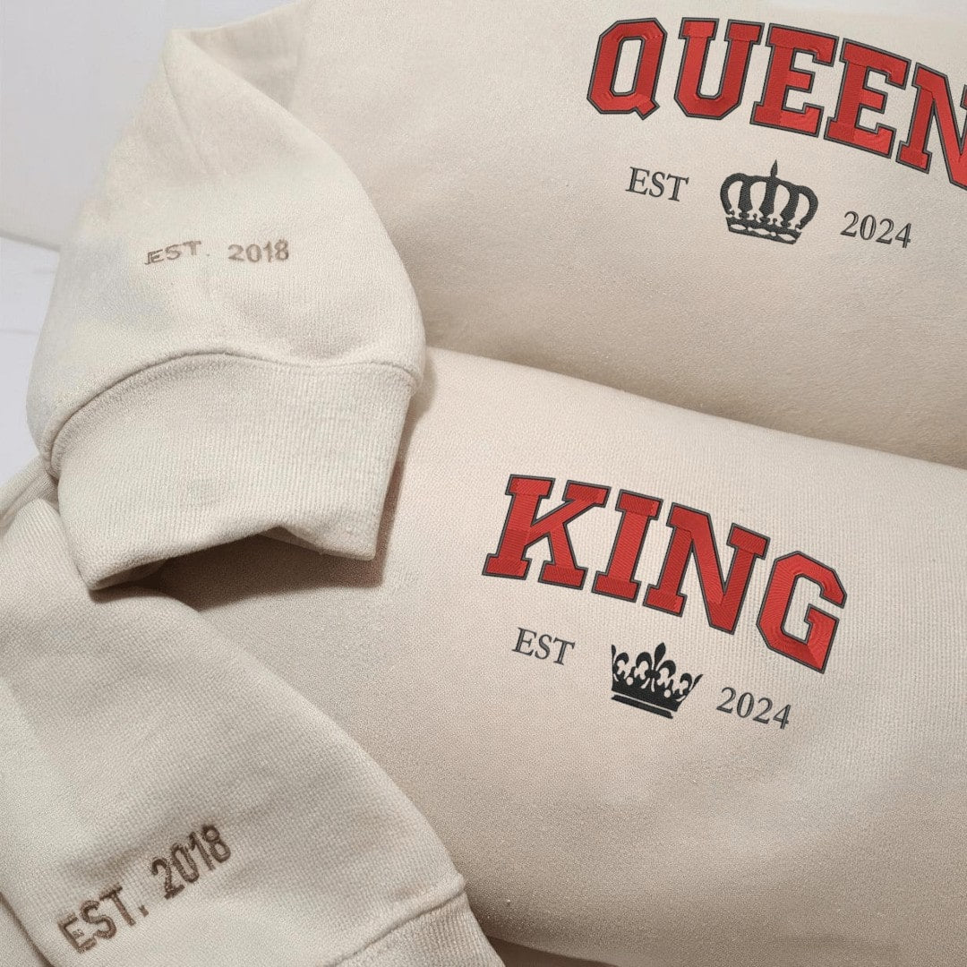 Stylish matching hoodies for couples with regal crown motifs and cozy fleece lining.