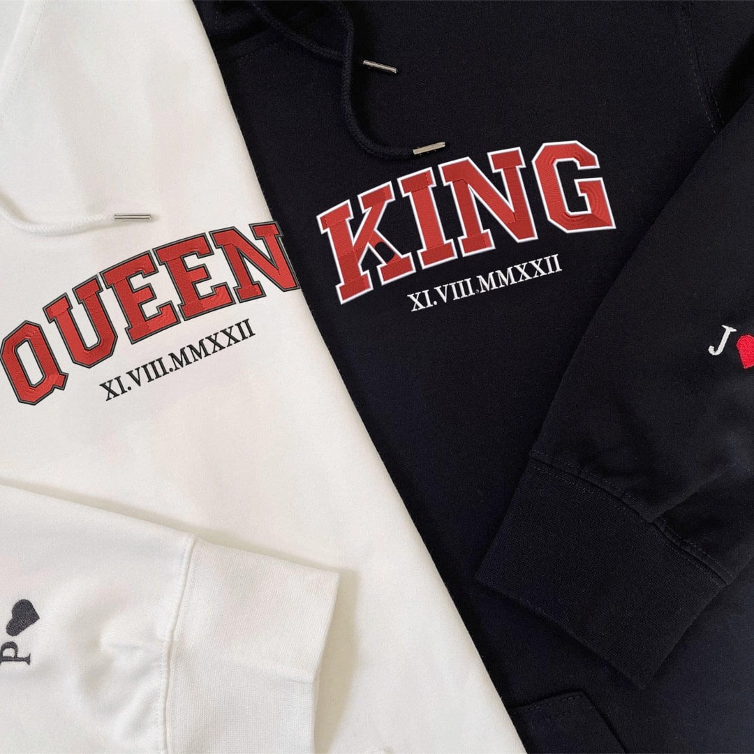 "King and Queen" matching hoodies with Roman numerals in bold red print