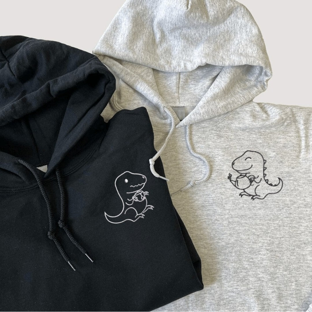 Black and gray "Tea Rex" matching hoodies with dinosaur tea designs