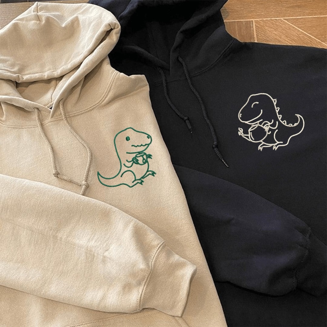 Close-up of custom "Tea Rex" hoodies with fun and cozy vibe