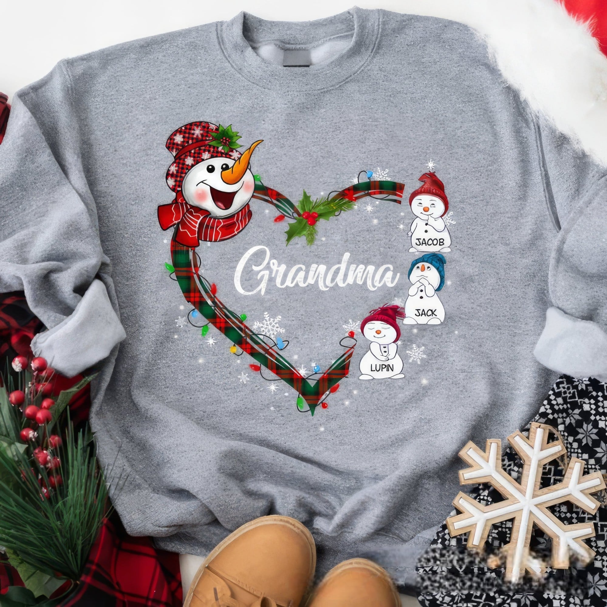 Custom holiday sweatshirt featuring plaid heart and snowman design