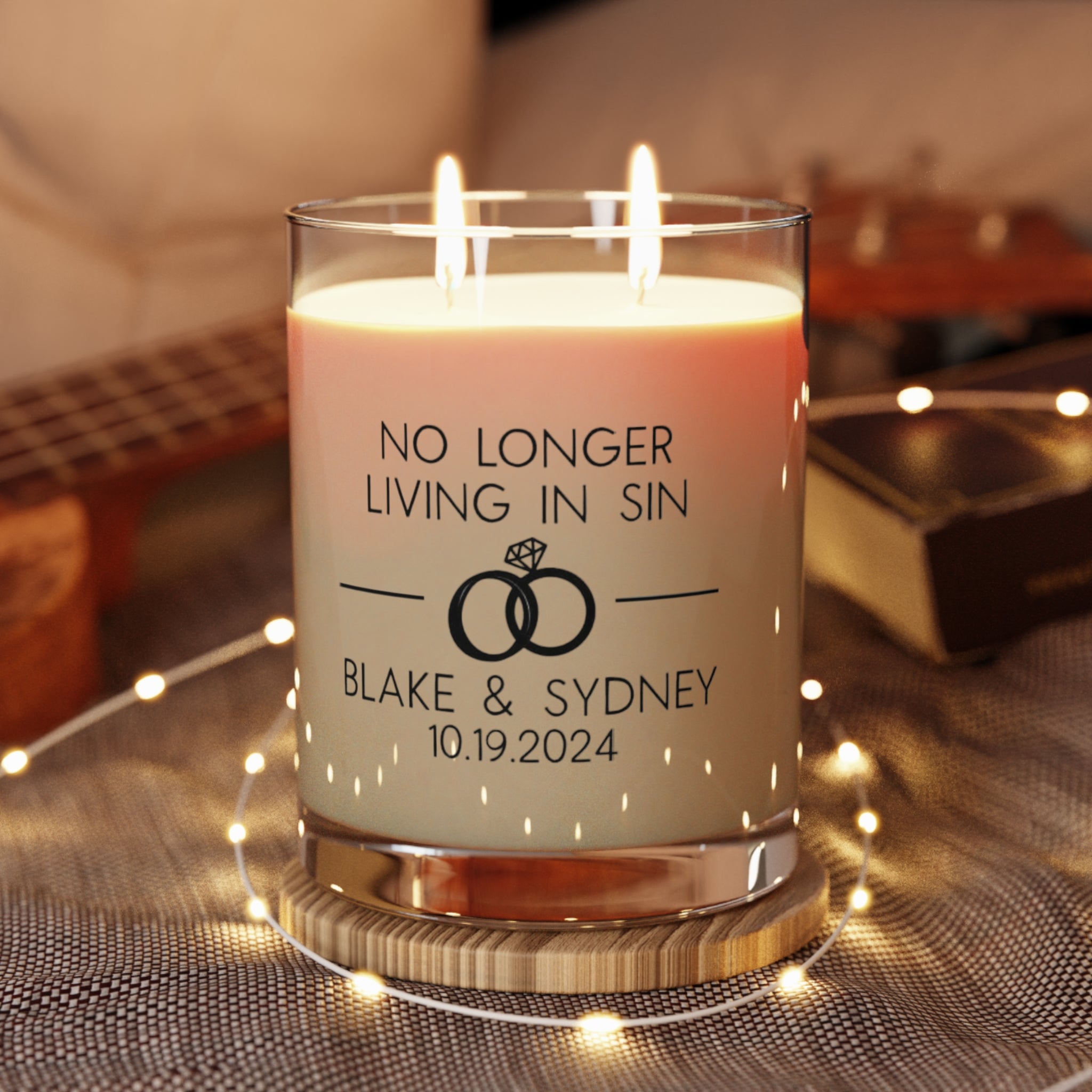 Personalized 'No Longer Living in Sin' candle with wedding rings design