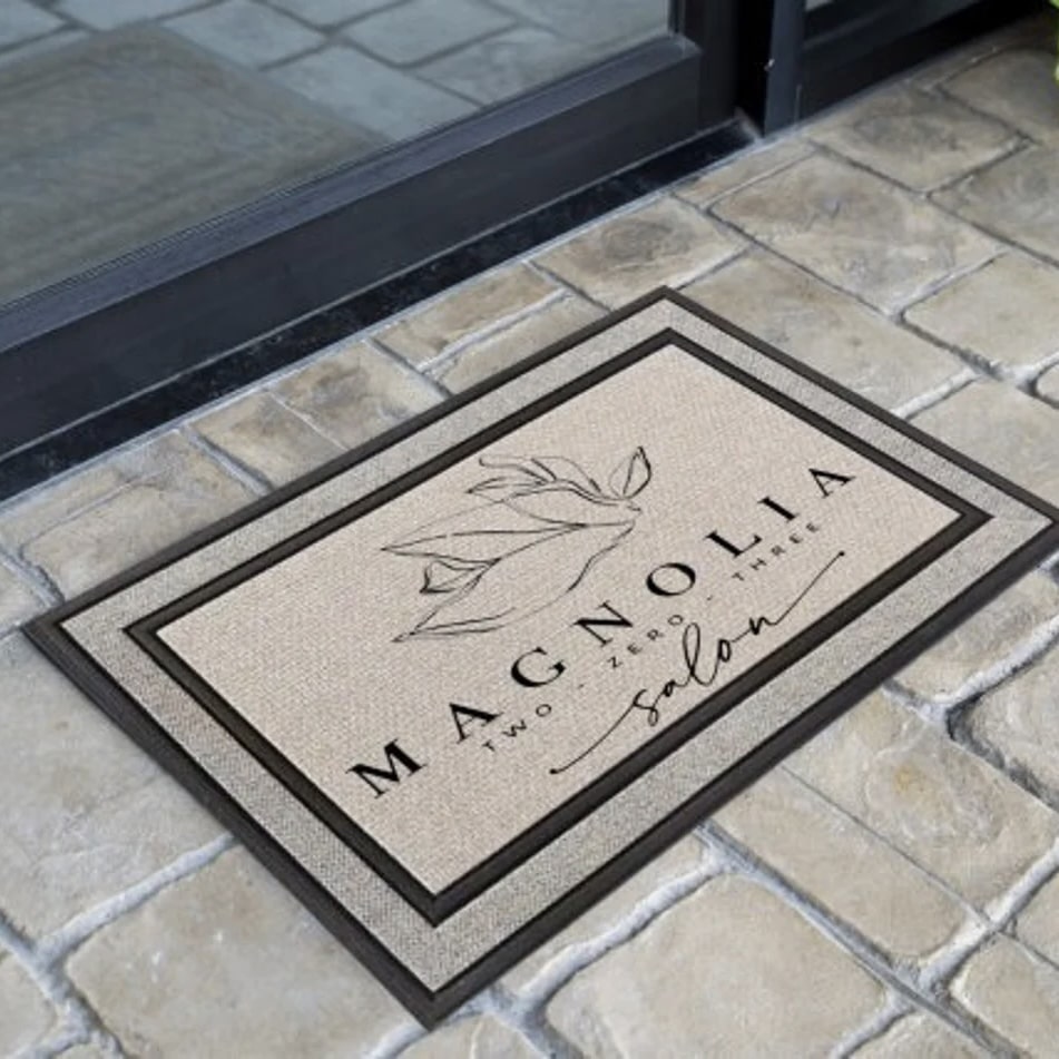 Custom Business Logo Door Mat on a stone pathway