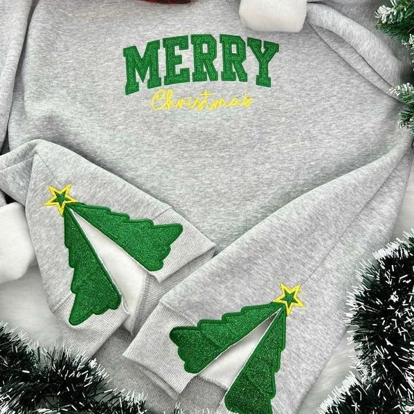 Gray sweatshirt with "Merry Christmas" text and glittery Christmas tree split hem design

