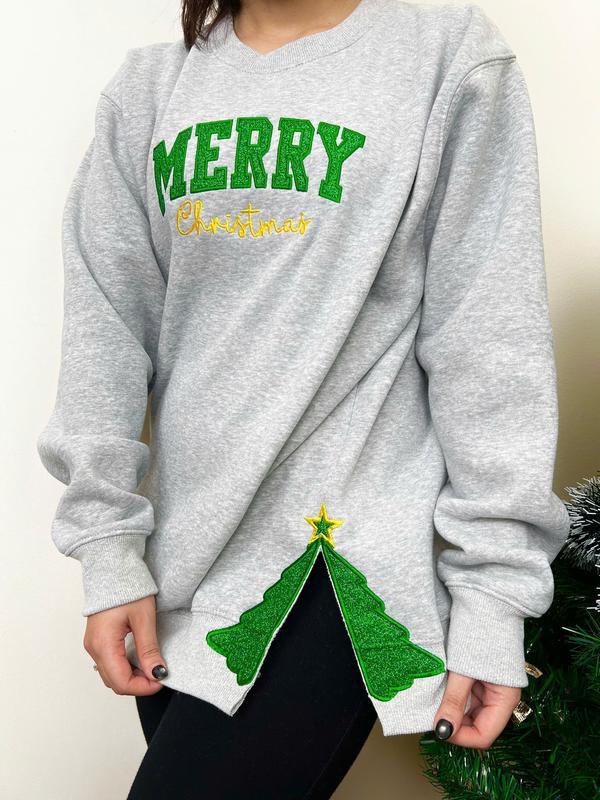 Gray sweatshirt with "Merry Christmas" text and glittery Christmas tree split hem design

