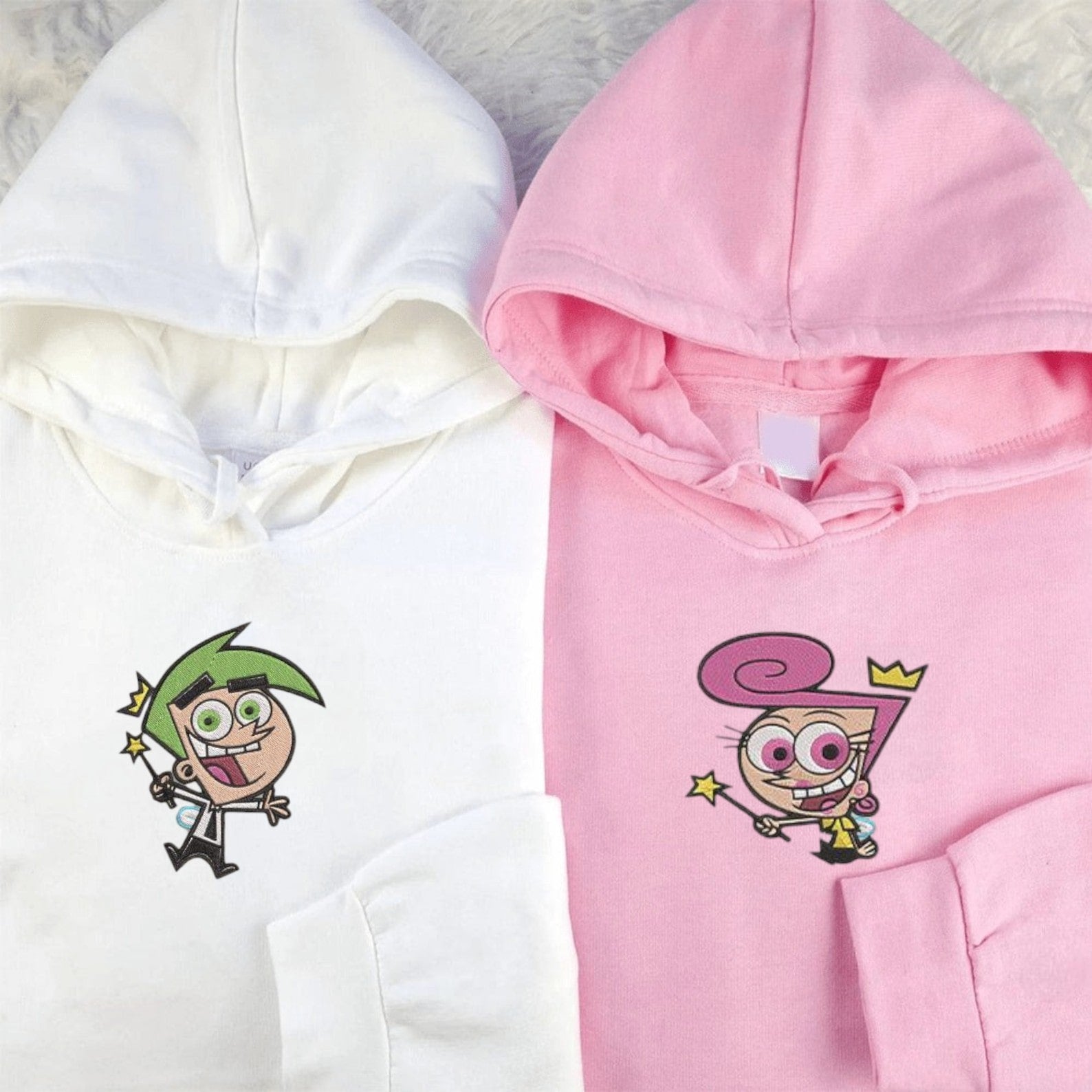 Matching Couple Hoodies designed as matching couple sweatshirts with playful cartoon fairy designs.
