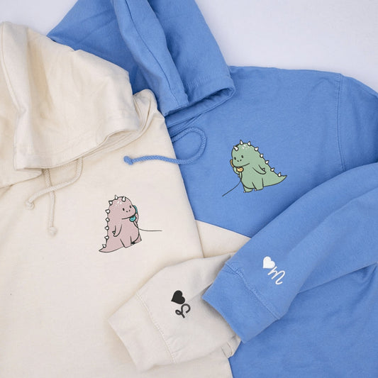 Matching Couple Hoodies with couples matching hoodies featuring cute dinosaur designs.
