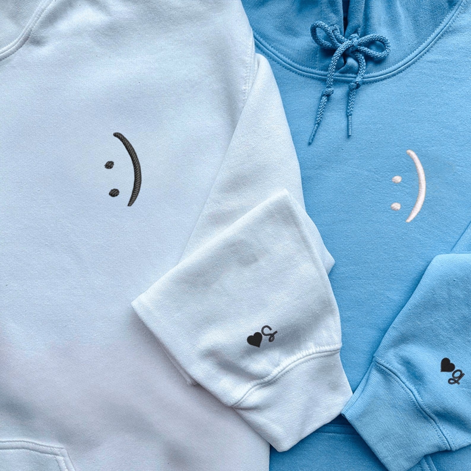 Matching Couple Hoodies styled as matching couple sweatshirts with simple smiley face prints.
