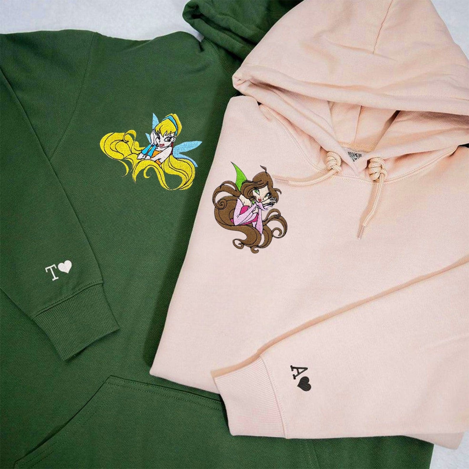 Whimsical hoodie with detailed fairy character design.