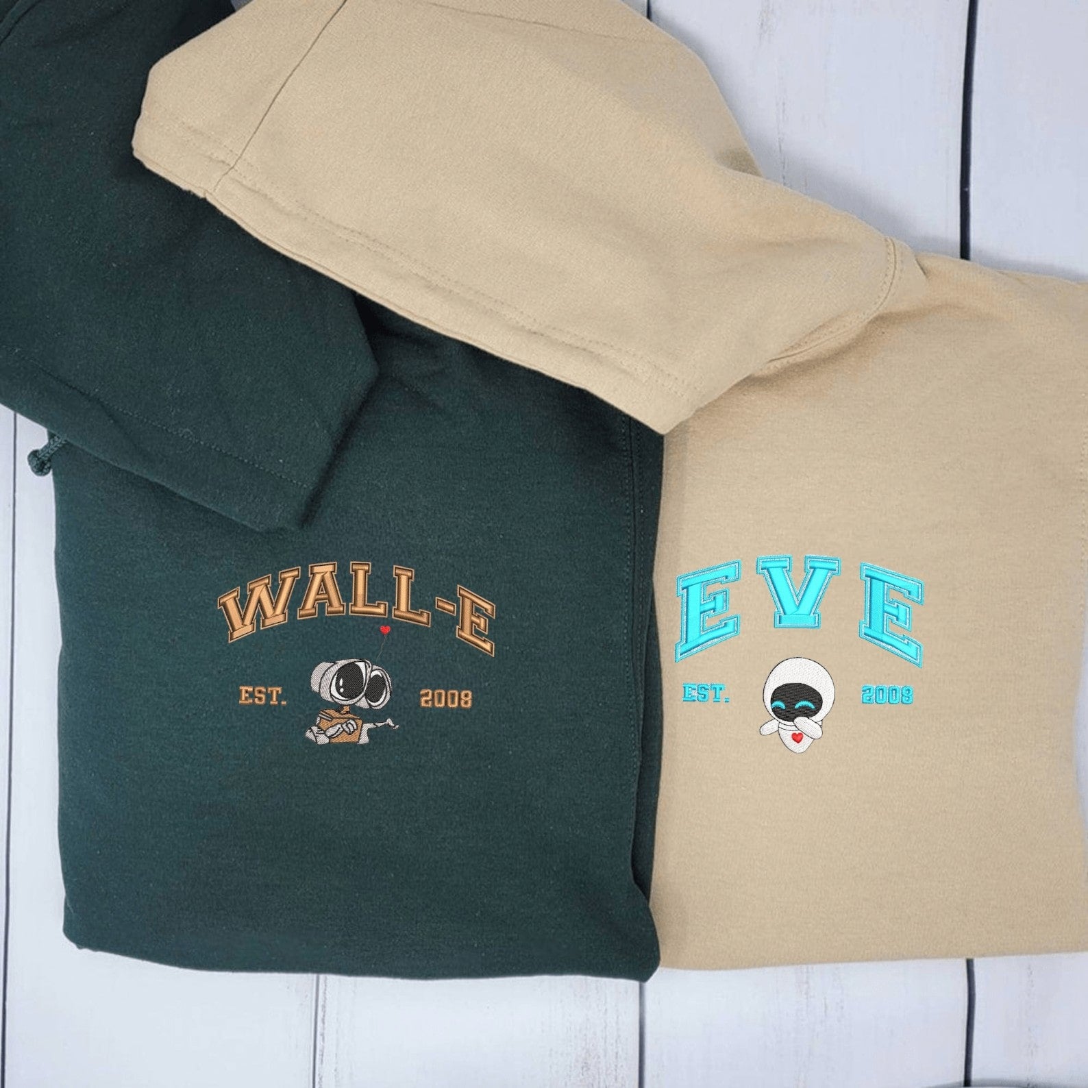 Matching Couple Hoodies styled as matching couple sweatshirts with adorable WALL-E and EVE prints.
