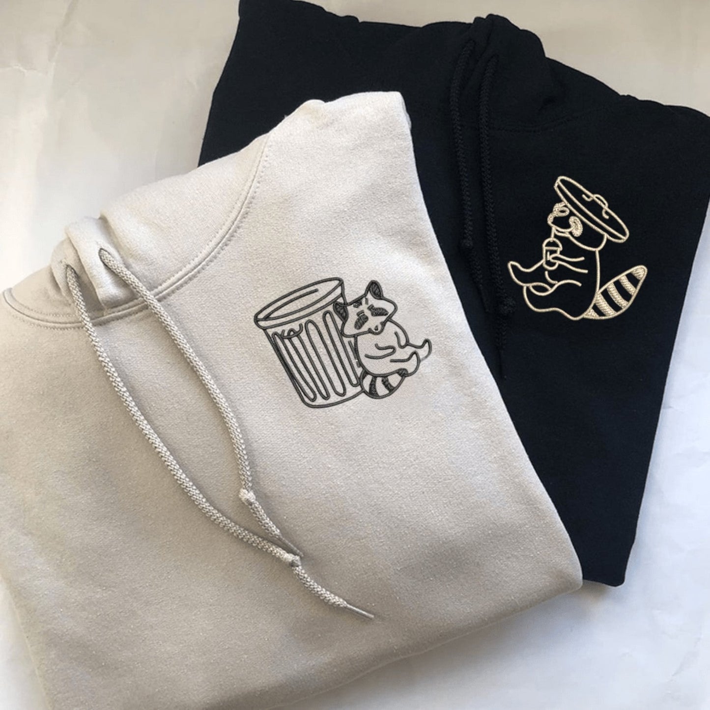 Matching Couple Hoodies featuring a raccoon and trash pandas design for couples matching hoodies.
