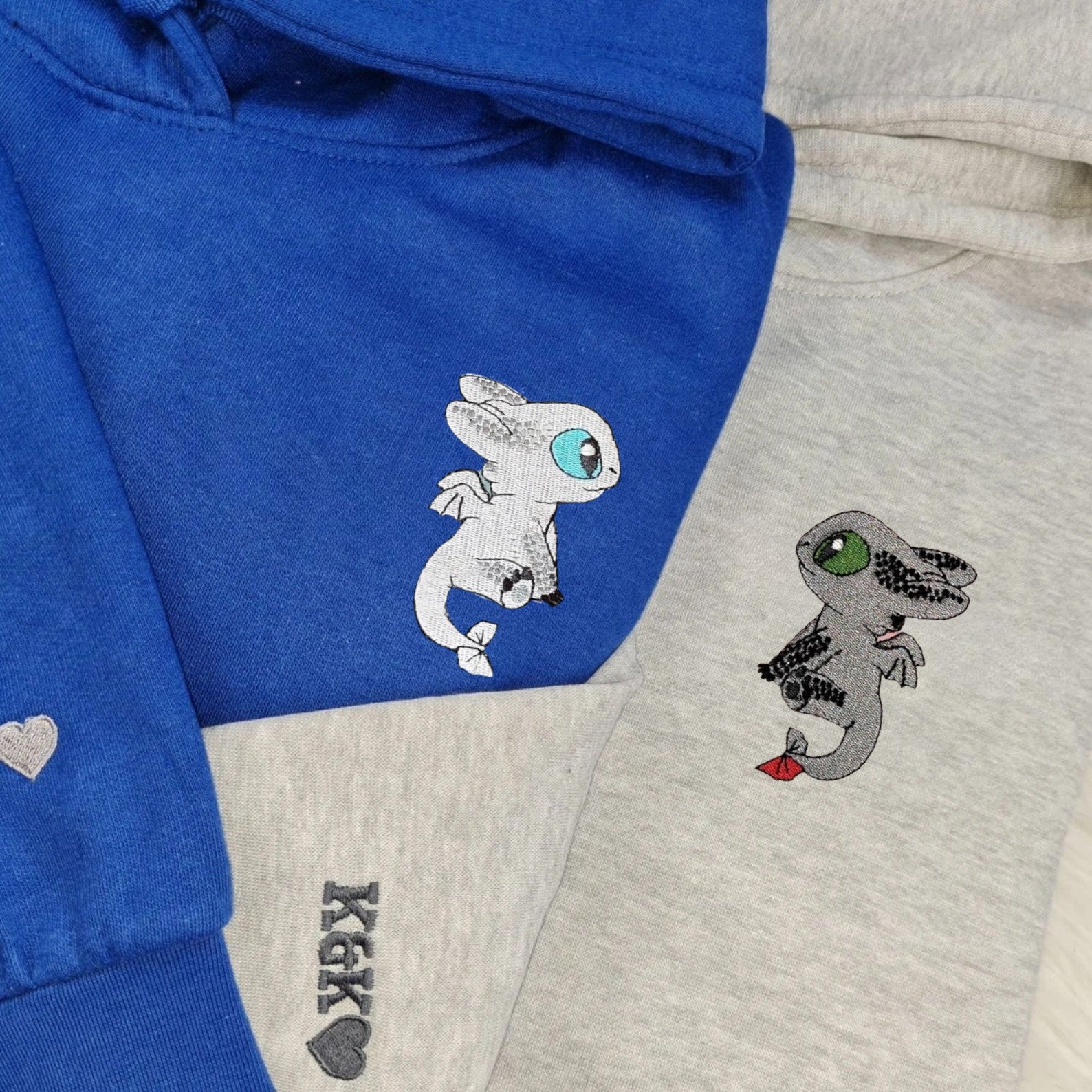 Matching Couple Hoodies featuring Toothless and Light Fury, perfect for couples matching hoodies.
