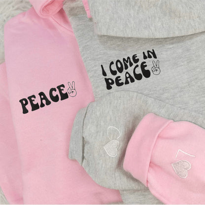 Matching Couple Hoodies featuring "Peace" and "I Come in Peace" designs, perfect for couples matching hoodies.
