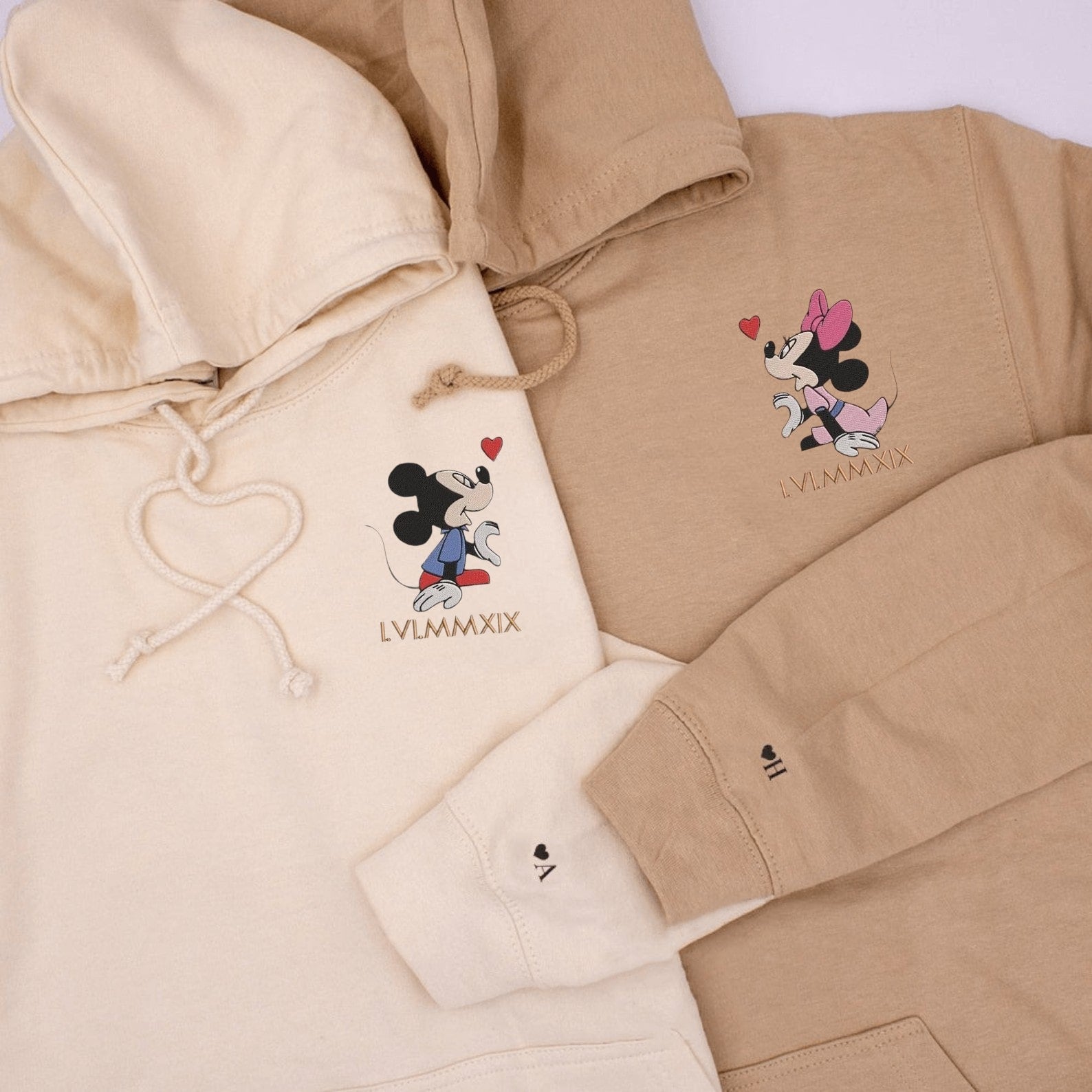 Matching Couple Hoodies featuring cartoon mouse couples matching hoodies with a Roman numeral date.
