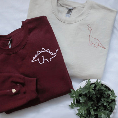 Matching Couple Hoodies with dinosaur designs, perfect for couples matching hoodies.
