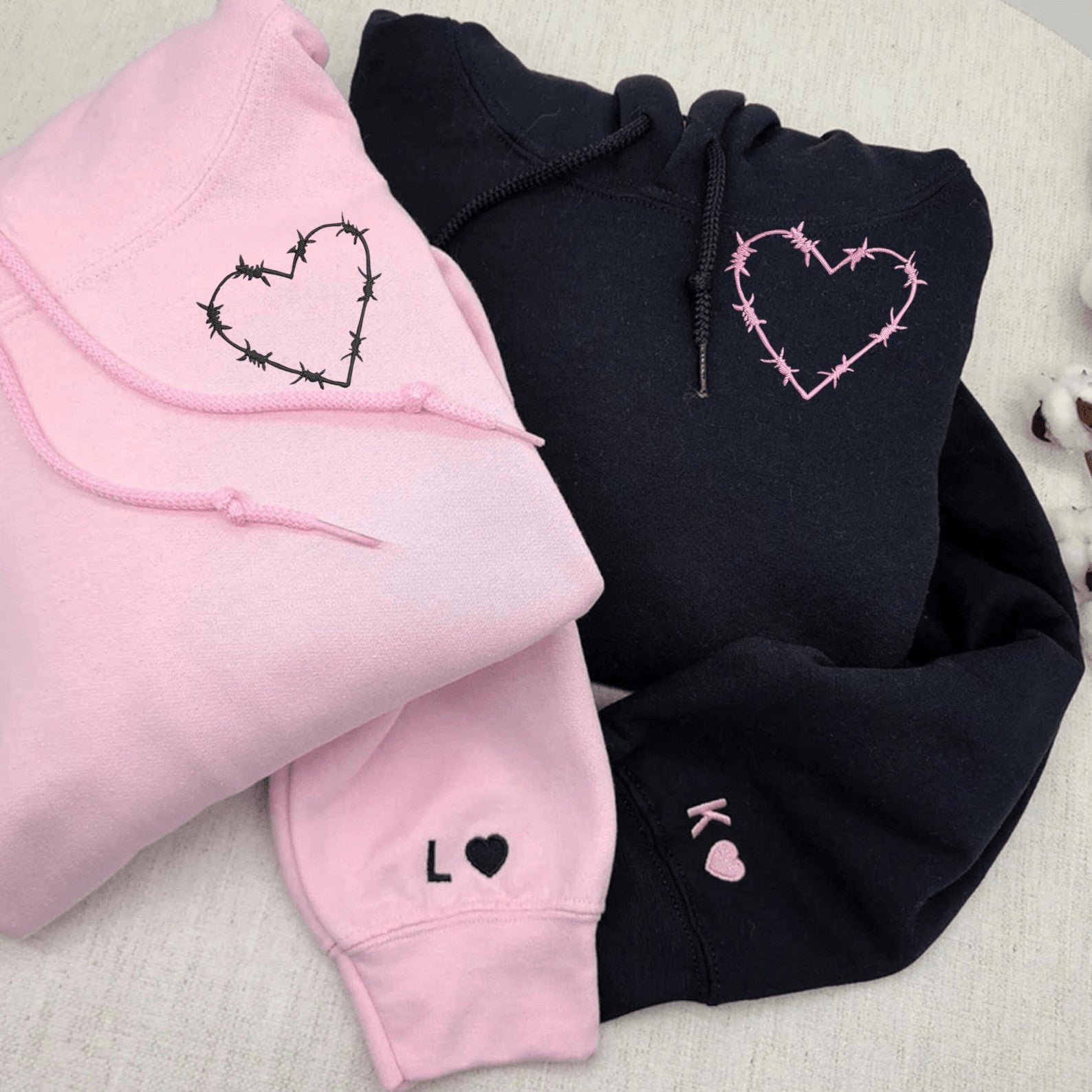 Matching Couple Hoodies with a barbed wire heart design, ideal for couples matching hoodies.
