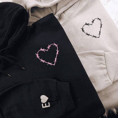 Matching Couple Hoodies featuring barbed wire heart designs on matching couple sweatshirts.
