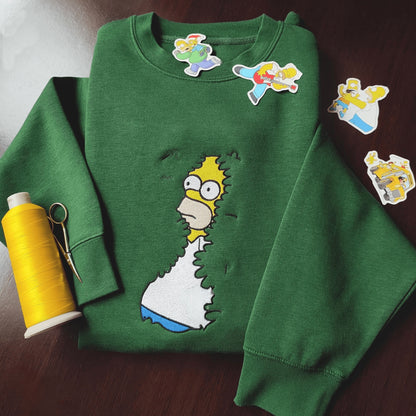 Meme shirts with embroidered cartoon character on a green personalized hoodie, capturing a t-shirt meme ideal for casual fashion.
