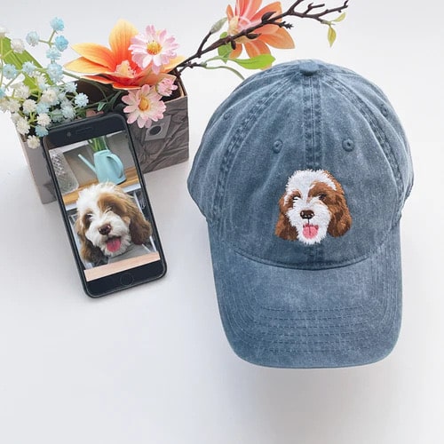 Close-up of high-quality pet-themed embroidery on stylish caps.