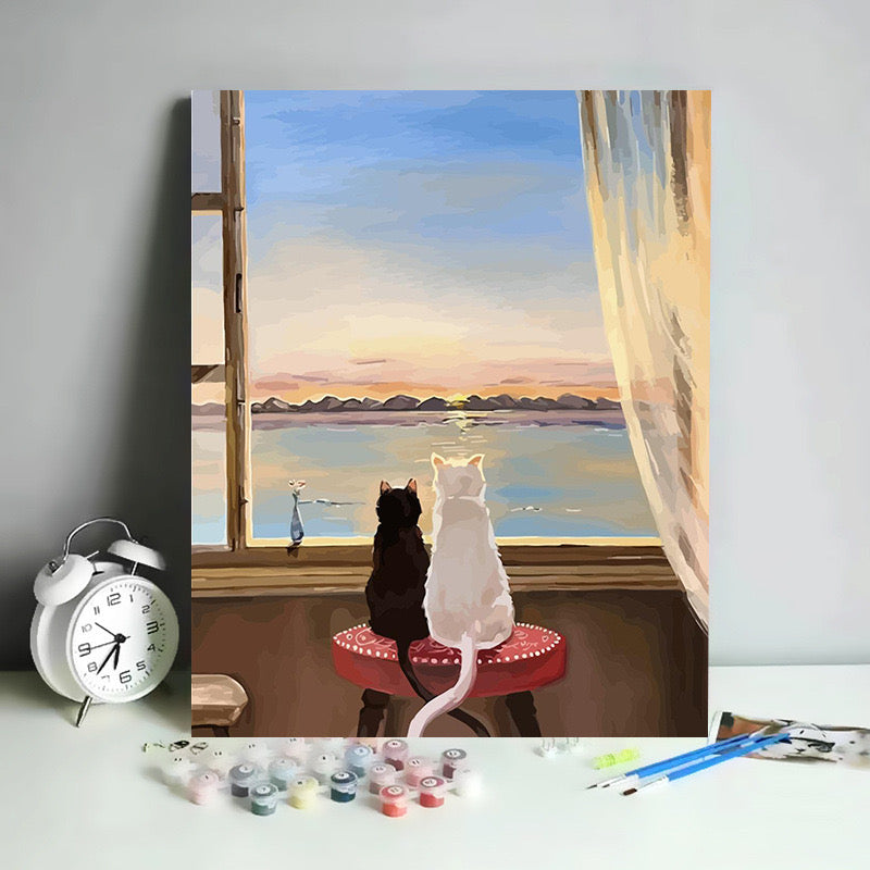 Paint by Numbers kit featuring two cats by a sunset window