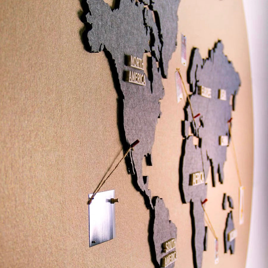 Map featuring photos attached with clothespins in regions such as Oceania.