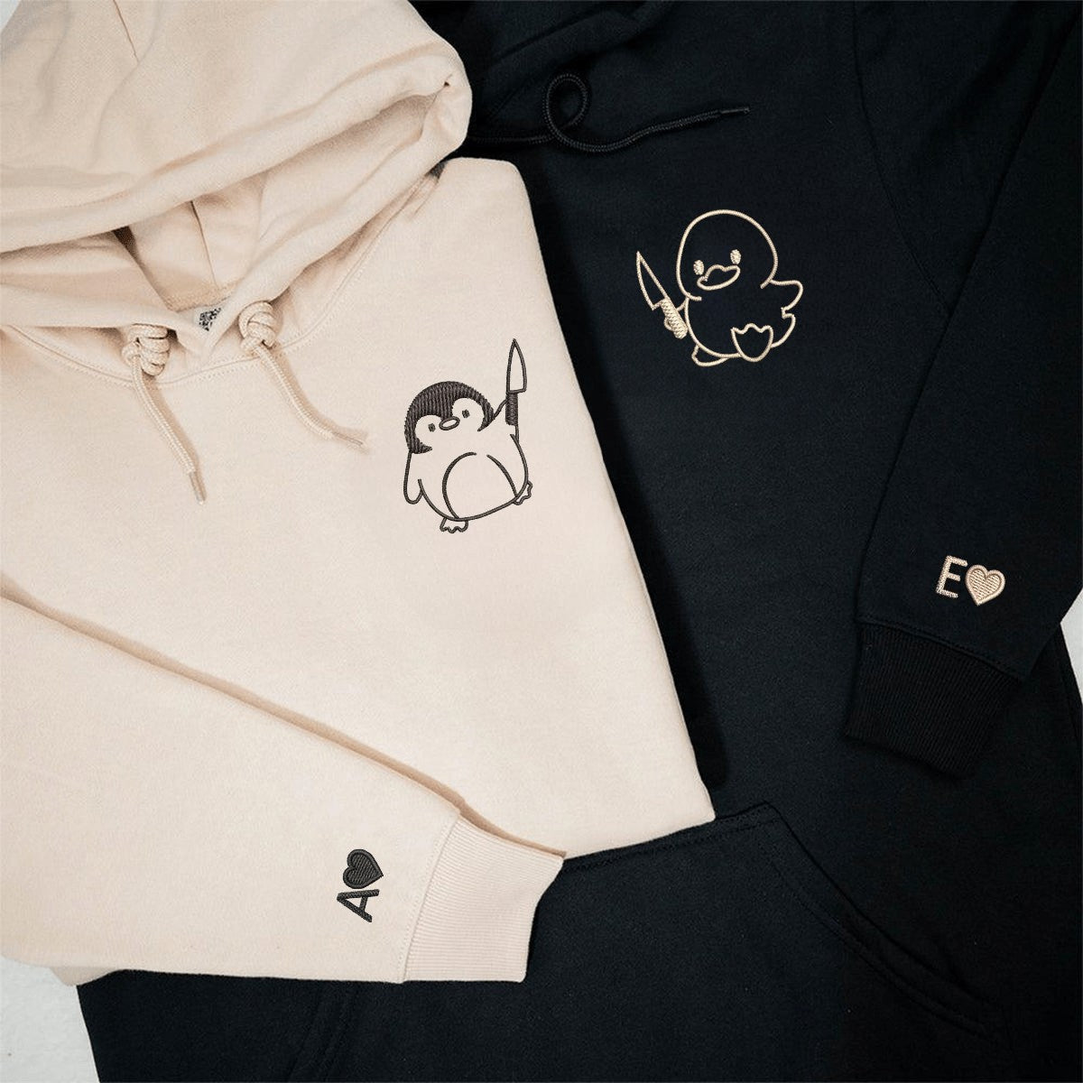 Unique graphic hoodies featuring duck and penguin cartoon with knives