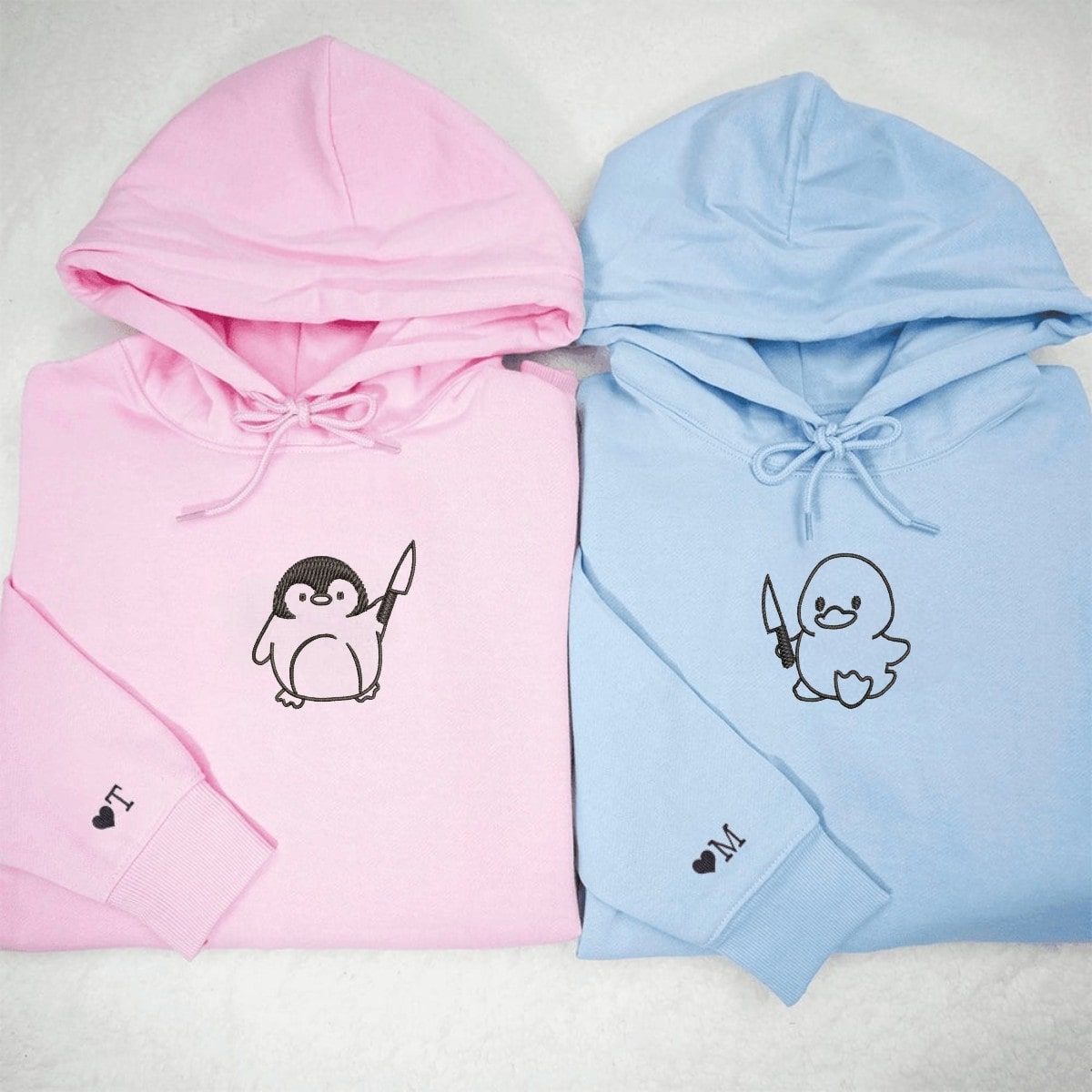 Soft fleece hoodie with playful duck and penguin knife designs