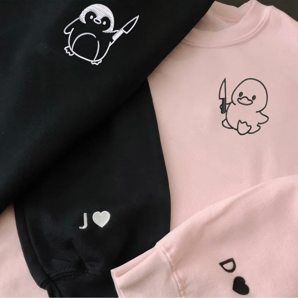 Pink and black hoodies featuring quirky animal graphics and custom initials