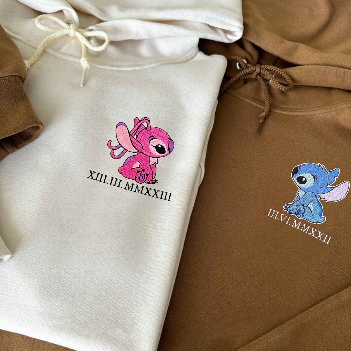 Embroidered hoodies for couples with iconic character designs and custom Roman numeral dates.