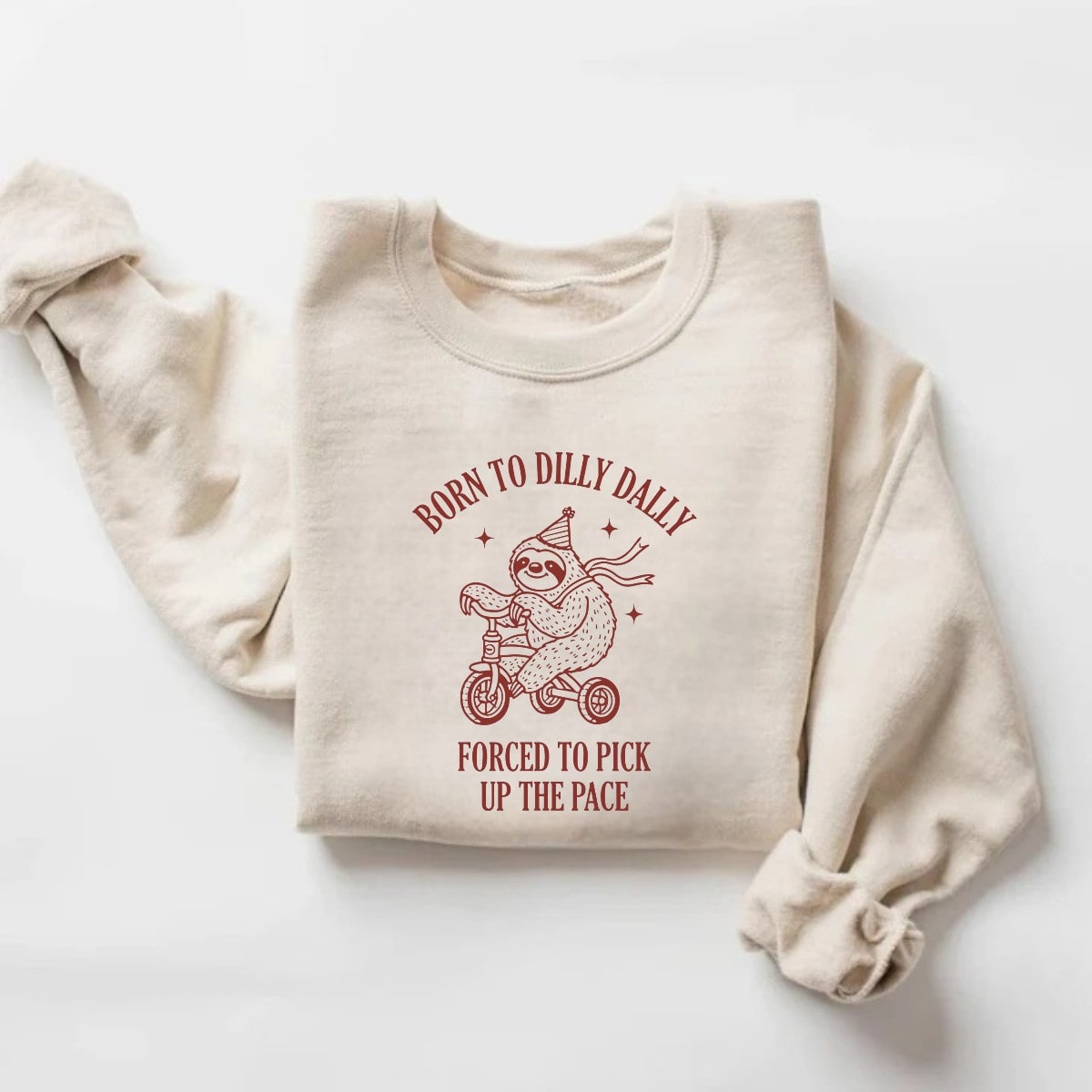 Beige Born to Dilly Dally sloth graphic sweatshirt with tricycle print