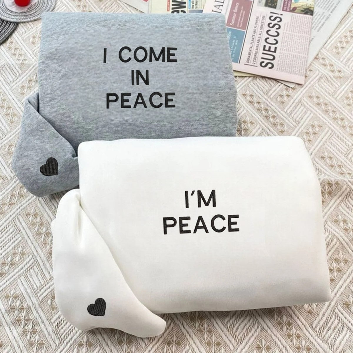 Matching couple sweatshirts with 'I COME IN PEACE' and 'I'M PEACE' minimalist designs.