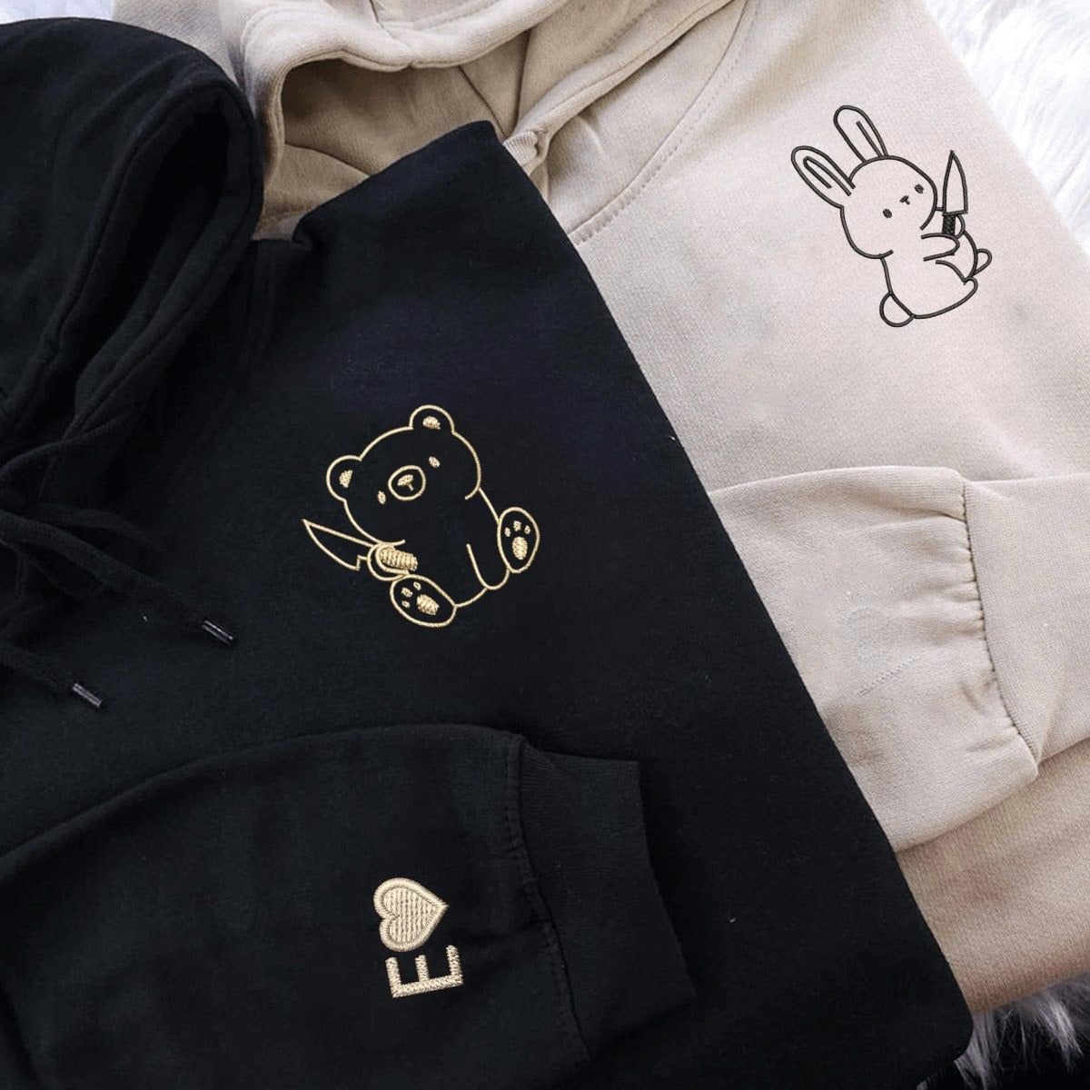 Couple sweatshirts featuring quirky rabbit and bear embroidery with custom initials.