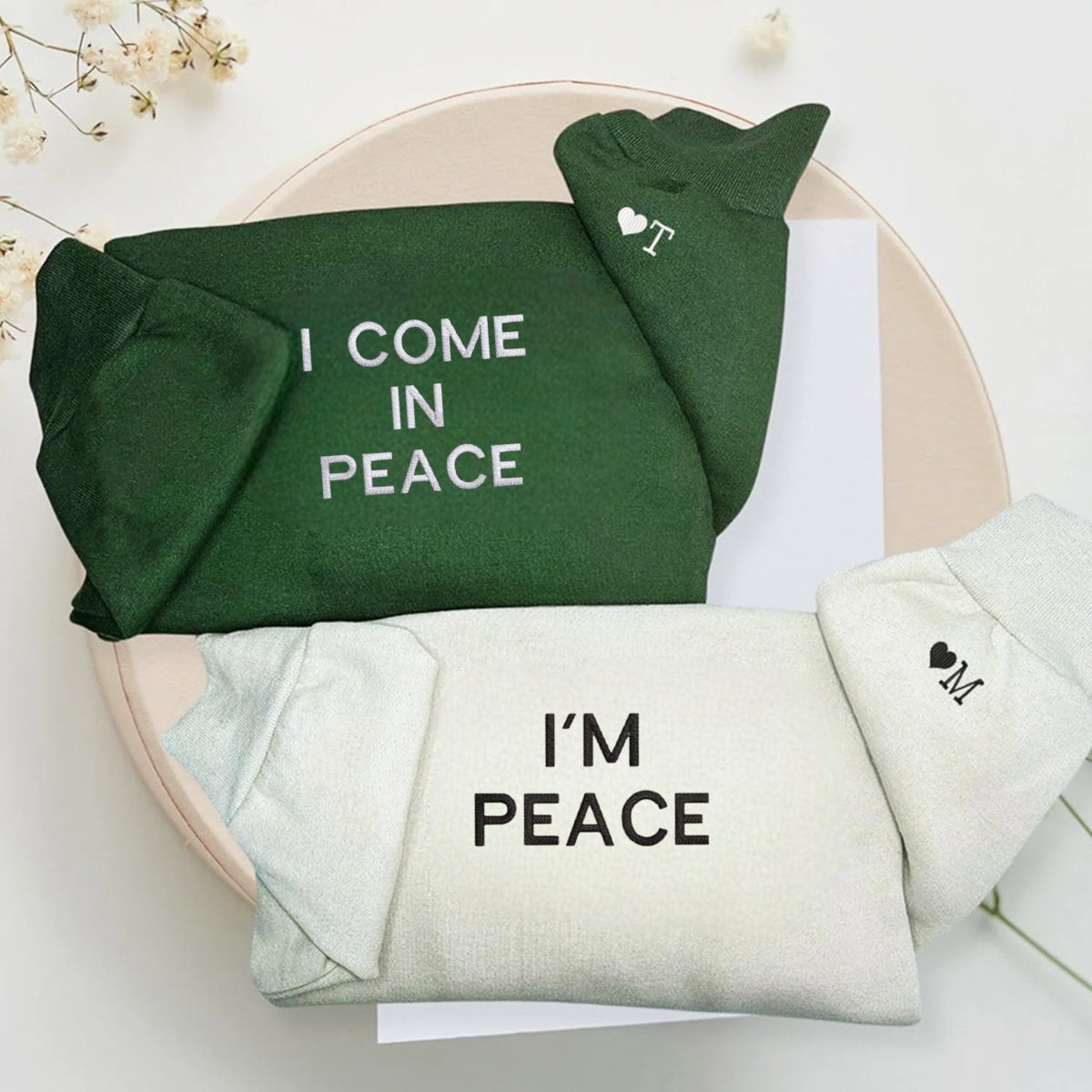 Couple sweatshirts featuring playful messages of unity and harmony.