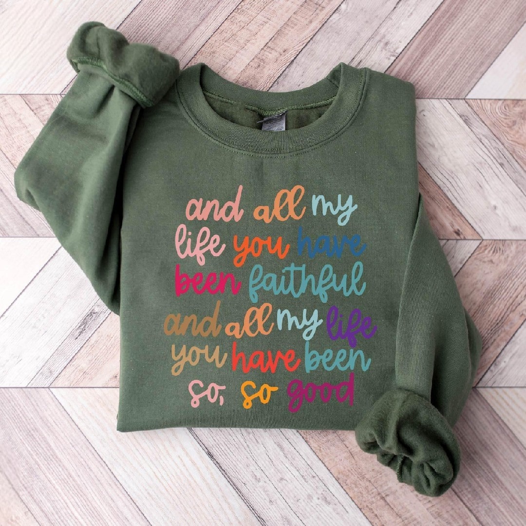 sweatshirt with colorful "And all my life You have been faithful" graphic.