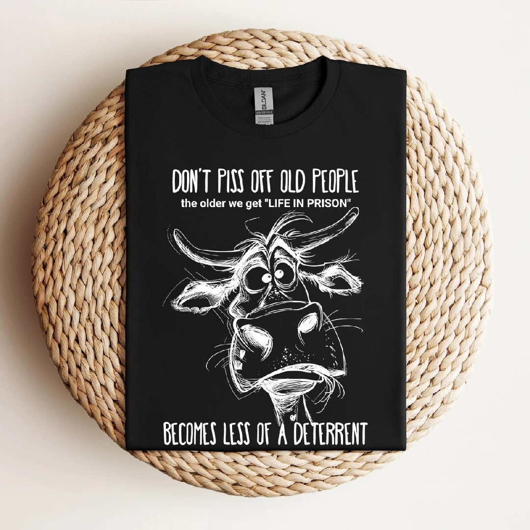 Black "Don't Piss Off Old People" humorous t-shirt with cow illustration