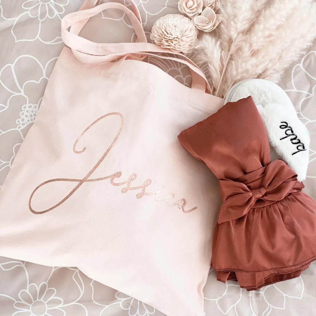 Elegant bridesmaid tote bags customized with names, perfect for bridal parties.