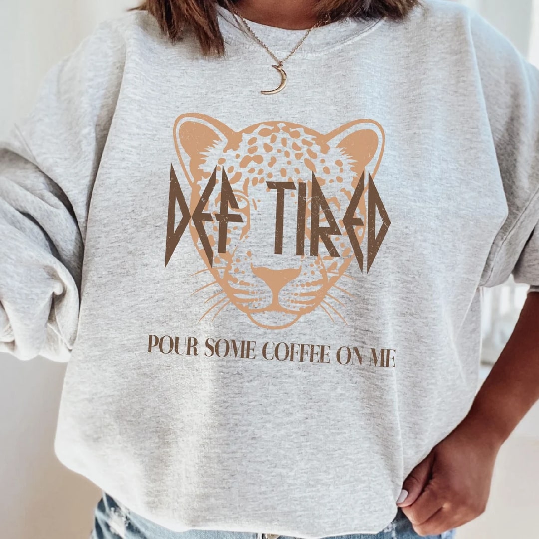 White "DEEP TIRED" graphic t-shirt with leopard and coffee print