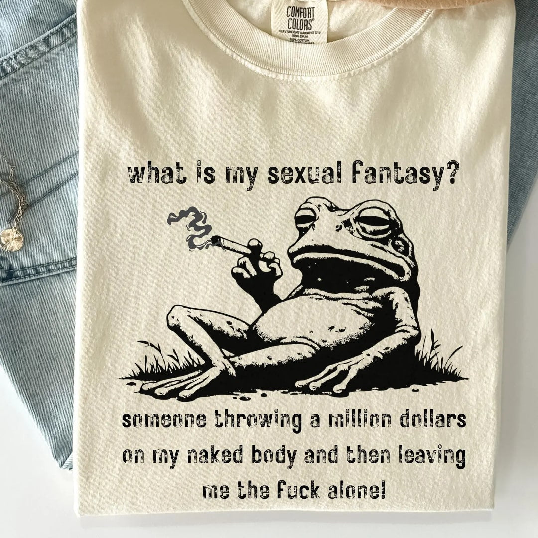 Close-up of a frog-themed graphic t-shirt with bold, edgy text and a relaxed fit