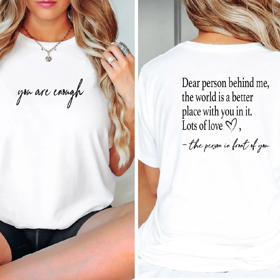 White T-shirt featuring motivational phrases on the front and back.