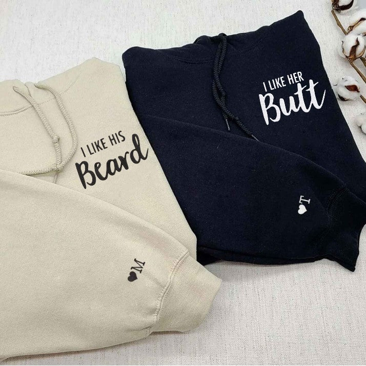 "I Like His Beard" and "I Like Her Butt" matching couple hoodies in beige and black, fun and stylish for couples.
