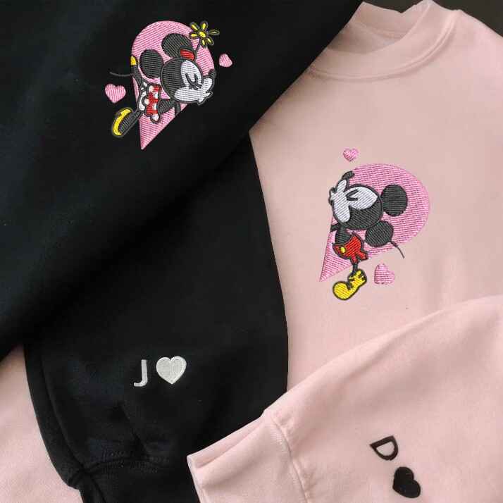 Adorable matching couple hoodies with Mickey and Minnie embroidery, featuring a unique split heart style for Disney fans who want to showcase their love.
