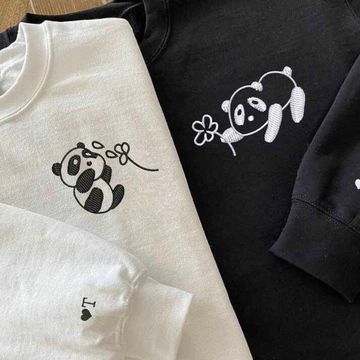 Matching panda embroidered sweatshirts for couples.
