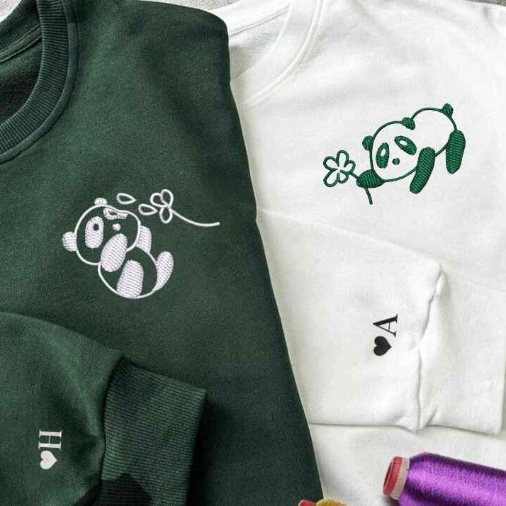 Cute panda couple hoodies with clover design.
