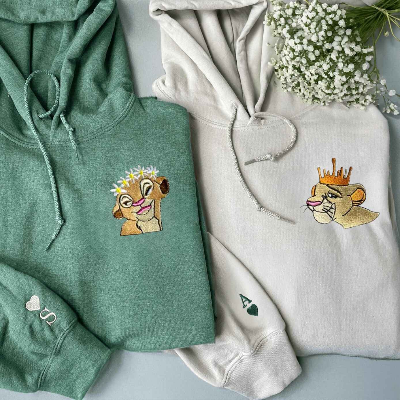 Cute couple sweatshirts with lioness and lion crown designs
