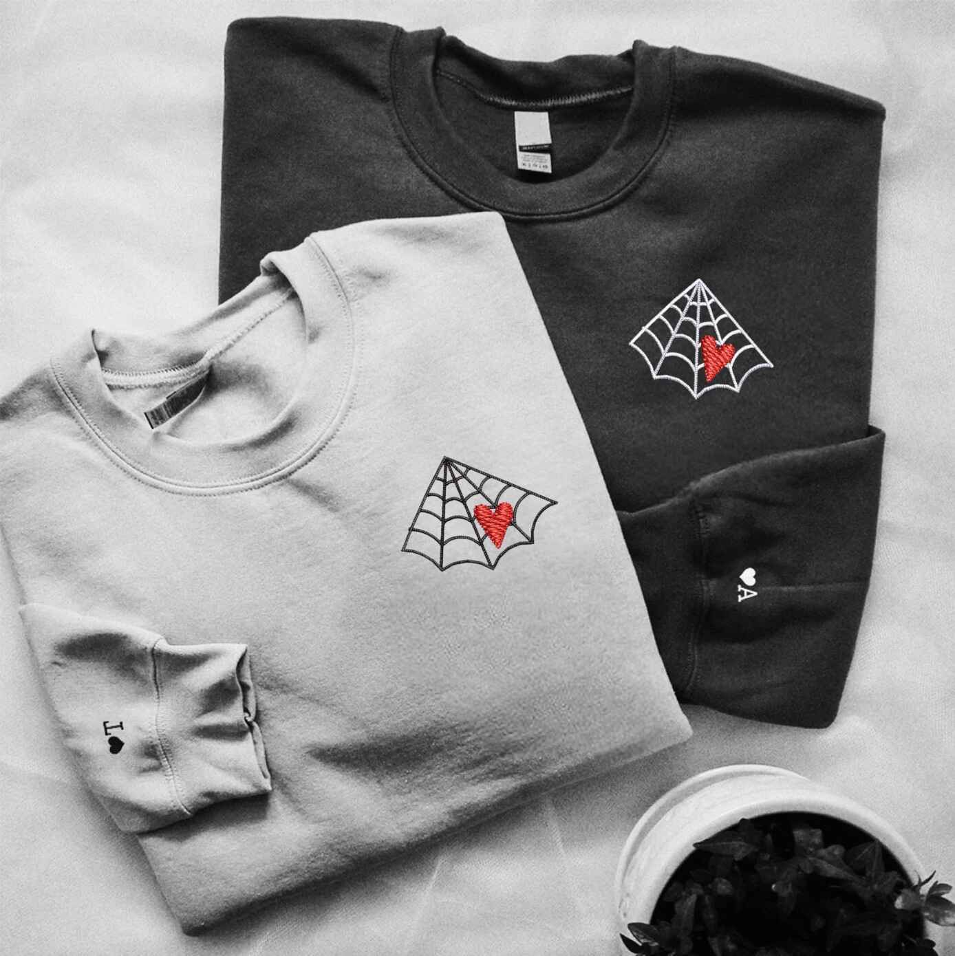 Matching Couple Hoodies with couples matching hoodies design featuring spider web and heart motifs
