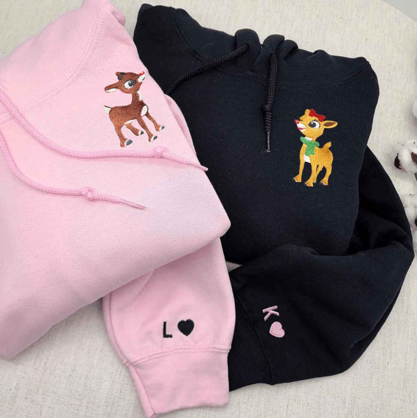 Matching couple hoodies with festive reindeer designs
