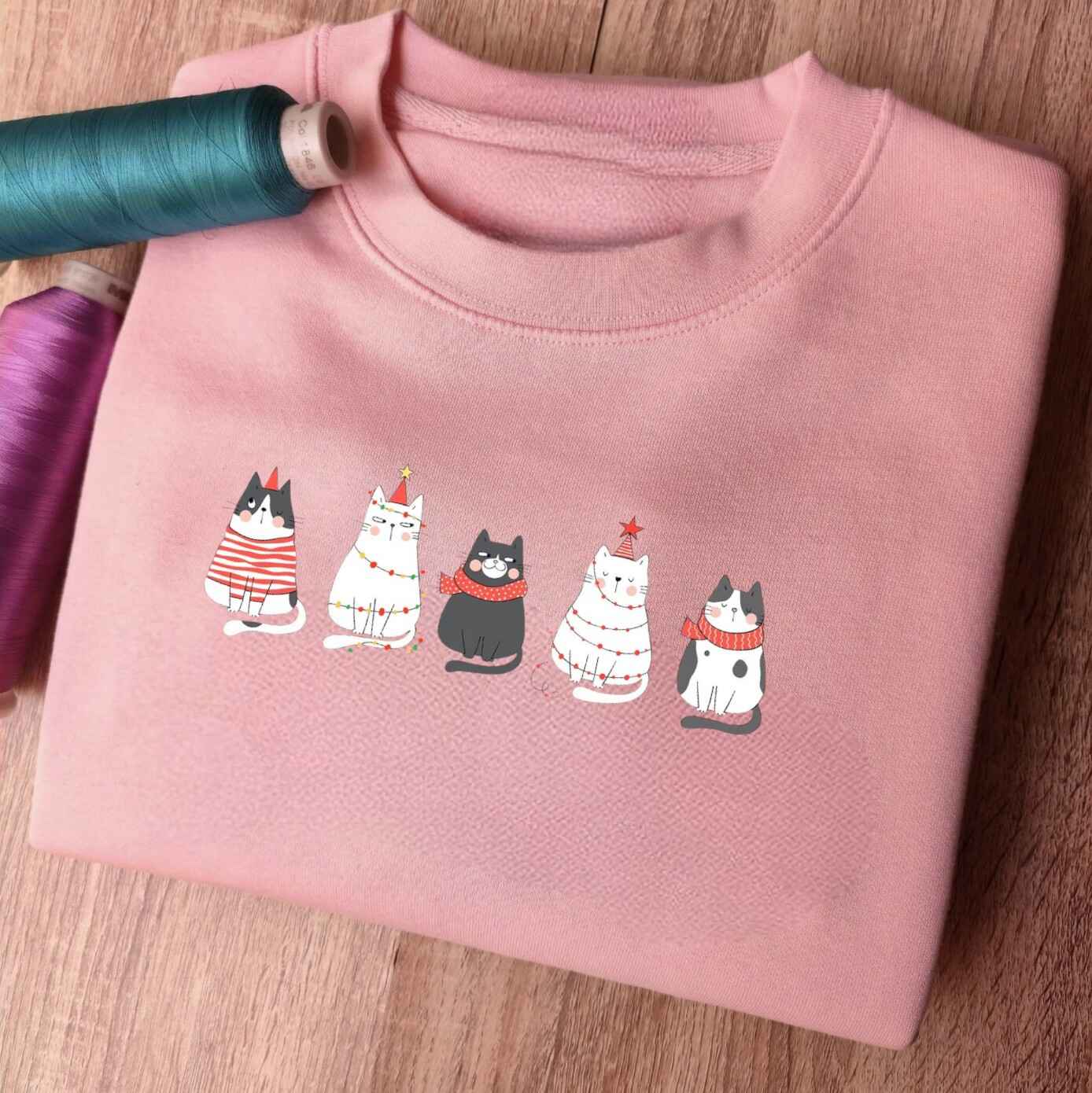 Customizable Christmas sweatshirt with festive cat illustrations
