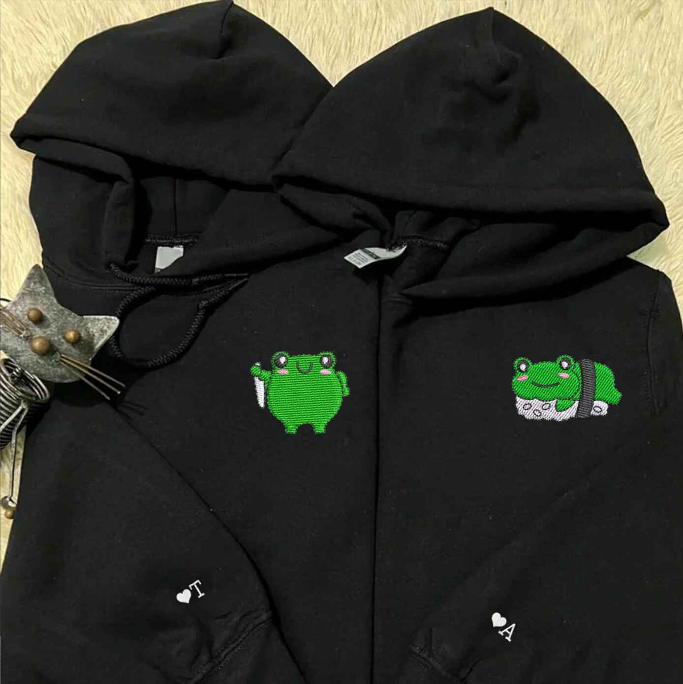 Cute frog-themed couple hoodies with personalization on the sleeve
