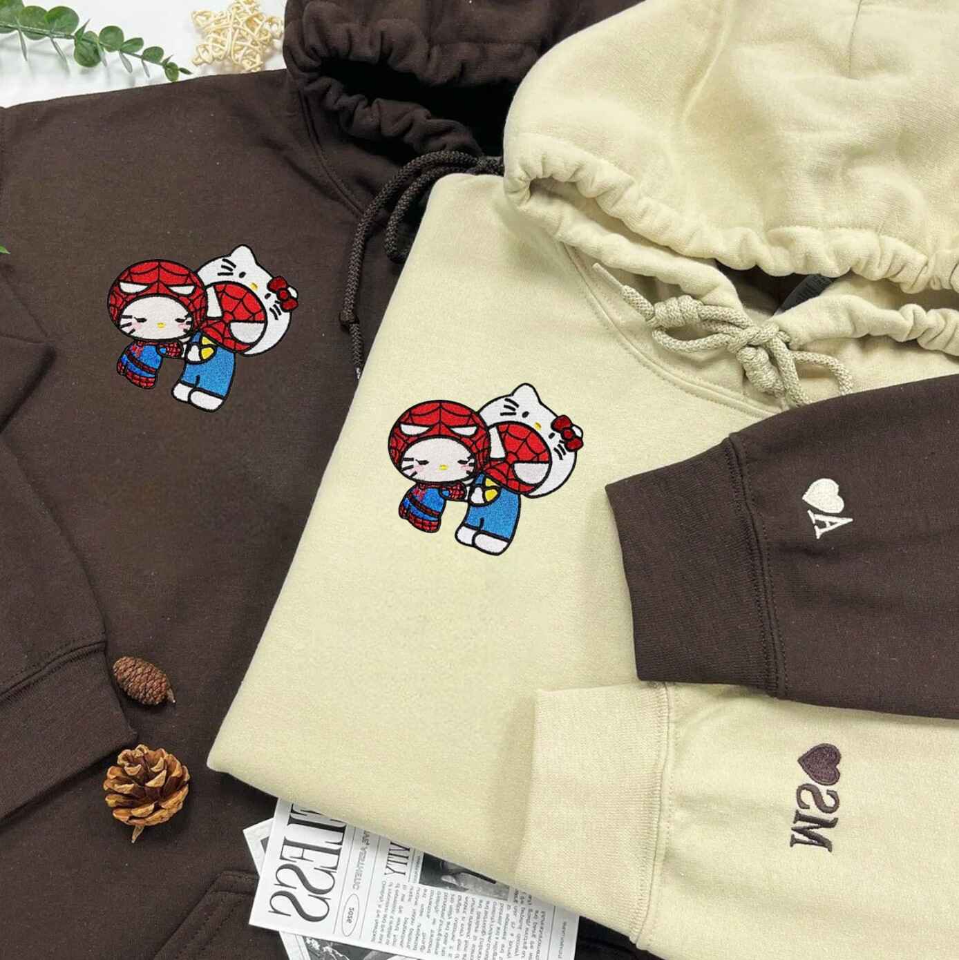 Kitty Hero couple hoodies with superhero-inspired embroidery
